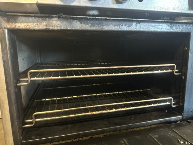 IMPERIAL COMMERCIAL NATURAL GAS 6 BURNER 24" GRIDDLE WITH DOUBLE OVEN ON CASTERS
