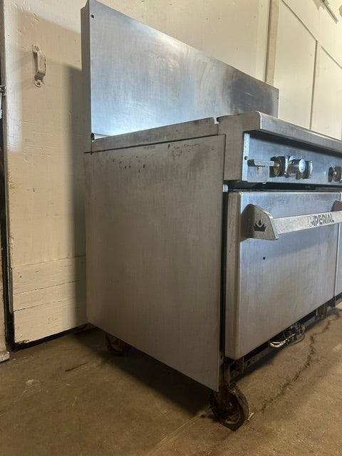 IMPERIAL COMMERCIAL NATURAL GAS 6 BURNER 24" GRIDDLE WITH DOUBLE OVEN ON CASTERS