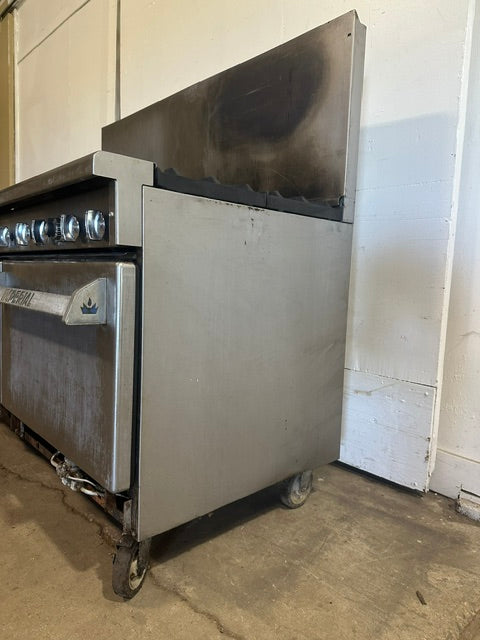 IMPERIAL COMMERCIAL NATURAL GAS 6 BURNER 24" GRIDDLE WITH DOUBLE OVEN ON CASTERS