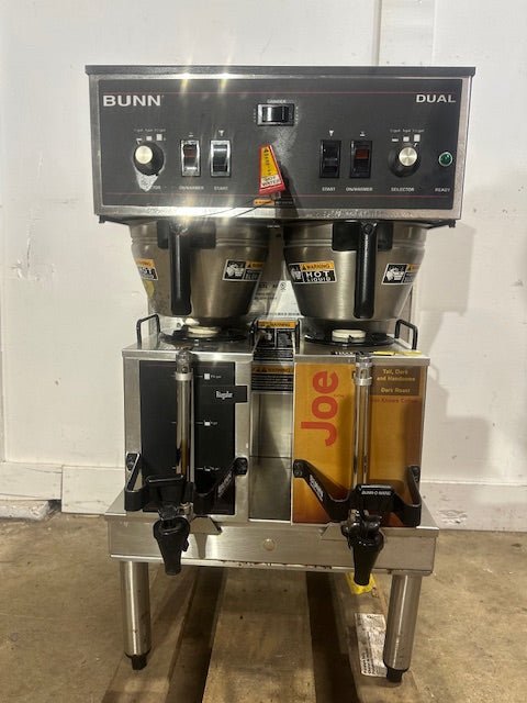 BUNN STAINLESS STEEL HEAVY DUTY COMMERCIAL COUNTER TOP DUAL COFFEE GRINDER/BREWER WITH WARMERS AND HOT WATER SPIGOT ON LEGS - Second Life - Equipment - collection_name