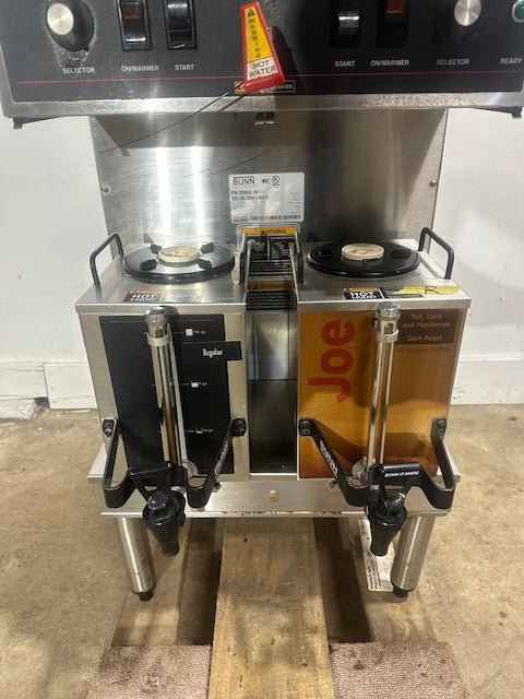 BUNN STAINLESS STEEL HEAVY DUTY COMMERCIAL COUNTER TOP DUAL COFFEE GRINDER/BREWER WITH WARMERS AND HOT WATER SPIGOT ON LEGS - Second Life - Equipment - collection_name