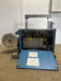 COMMERCIAL HEADYDUTY AUTO FEED HIGH SPEED POLY STRAPPING MACHINE - Second Life - Equipment - collection_name