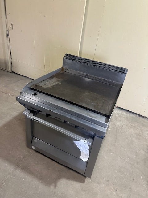 GARLAND HEAVY DUTY STAINLESS STEEL COMMERCIAL GRIDDLE/GRILL WITH STANDARD OVEN BASE ON CASTERS 33000BTU/HR OVEN 40000BTU/HR - Bargains R Ours - #collection_name#