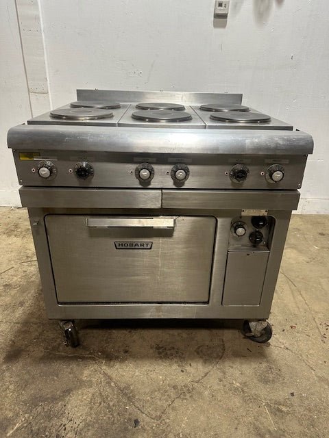 "HOBART CR43" 6 BURNERS DUAL PHASE ELECTRIC STOVE/RANGE W/OVEN AND 2 DRIP TRAYS ON CASTERS - Second Life - Equipment - collection_name