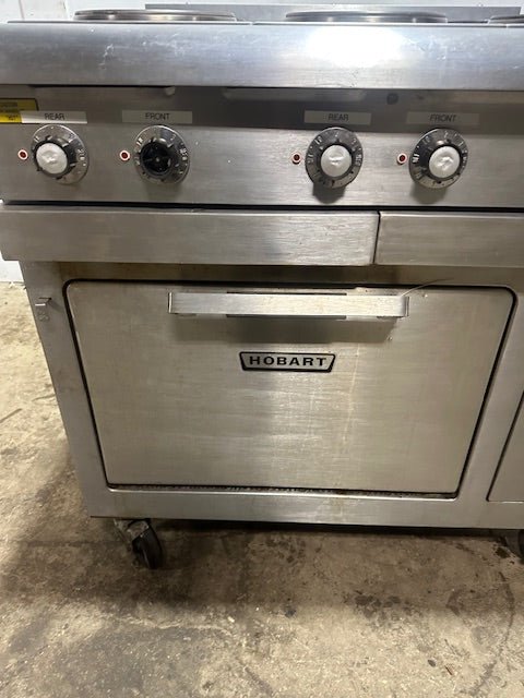 "HOBART CR43" 6 BURNERS DUAL PHASE ELECTRIC STOVE/RANGE W/OVEN AND 2 DRIP TRAYS ON CASTERS - Second Life - Equipment - collection_name