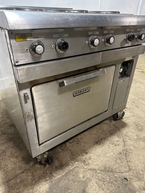 "HOBART CR43" 6 BURNERS DUAL PHASE ELECTRIC STOVE/RANGE W/OVEN AND 2 DRIP TRAYS ON CASTERS - Second Life - Equipment - collection_name
