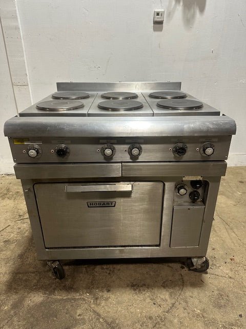 "HOBART CR43" 6 BURNERS DUAL PHASE ELECTRIC STOVE/RANGE W/OVEN AND 2 DRIP TRAYS ON CASTERS - Second Life - Equipment - collection_name