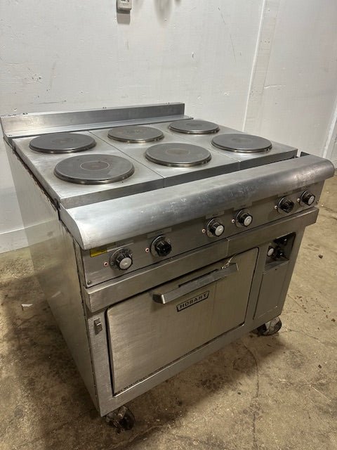 "HOBART CR43" 6 BURNERS DUAL PHASE ELECTRIC STOVE/RANGE W/OVEN AND 2 DRIP TRAYS ON CASTERS - Second Life - Equipment - collection_name