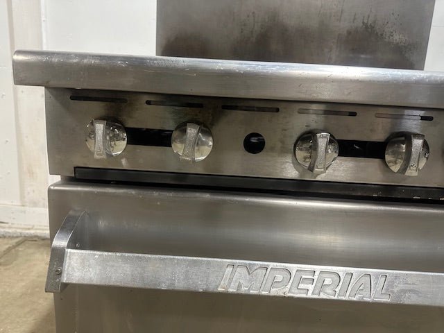 "IMPERIAL" NATURAL GAS HEAVY DUTY COMMERCIAL 6 BURNER STOVE WITH OVEN ON CASTERS - Second Life - Equipment - collection_name