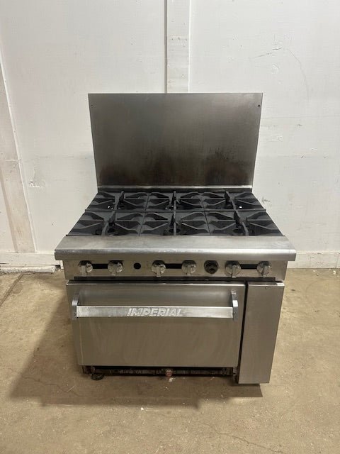 "IMPERIAL" NATURAL GAS HEAVY DUTY COMMERCIAL 6 BURNER STOVE WITH OVEN ON CASTERS - Second Life - Equipment - collection_name