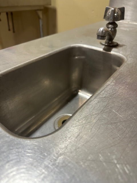 INTERNATIONAL DAIRY QUEEN INC. STAINLESS STEEL SERVICING TABLE STATION AND WASH SINK BOWL WITH FAUCET, BACK SPLASH AND UNDER STORAGE COMPARTMENT - Bargains R Ours - #collection_name#