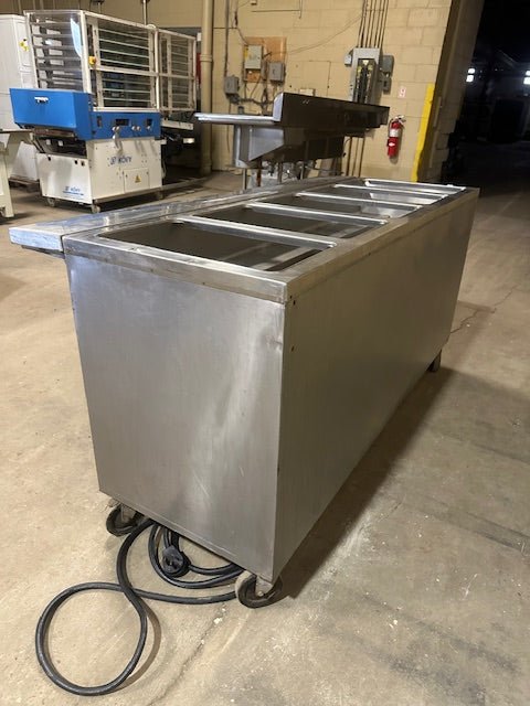 R - S RESTAURANT EQUIPMENT STAINLESS STEEL 5 STEAM HOT WELLS SERVICING LINE TABLE ON CASTERS STORAGE COMPARTMENT SLIDE DOORS FOLD - ABLE LEAF - Bargains R Ours - #collection_name#