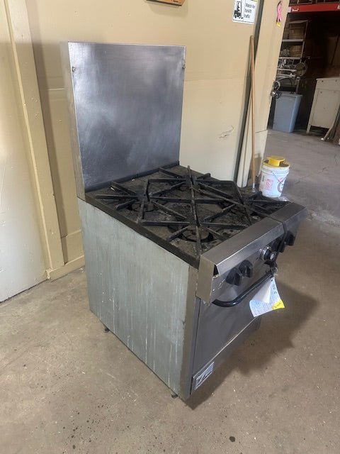 SOUTHBEND NATURAL GAS 4 BURNER STOVE WITH OVEN ON LEGS TALL BACK SPLASH GUARD AND GREASE CATCHER - Bargains R Ours - #collection_name#