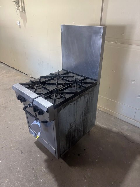 SOUTHBEND NATURAL GAS 4 BURNER STOVE WITH OVEN ON LEGS TALL BACK SPLASH GUARD AND GREASE CATCHER - Bargains R Ours - #collection_name#