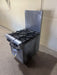 SOUTHBEND NATURAL GAS 4 BURNER STOVE WITH OVEN ON LEGS TALL BACK SPLASH GUARD AND GREASE CATCHER - Bargains R Ours - #collection_name#